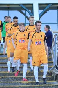 Ossett Albion player-chairman Dominic Riordan leads his club out at Shelley