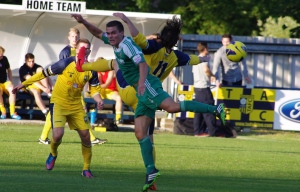 Bradford (Park Avenue)'s Nathan Turner and new Tadcaster Albion forward Josh Greening leap for the ball