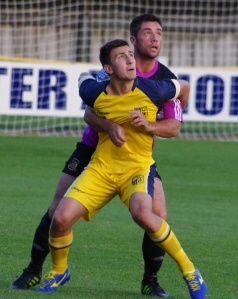 Tadcaster Albion striker Calum Ward holds off his marker