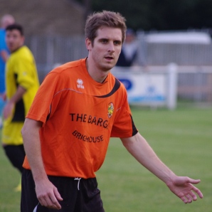 Brighouse Town striker Tom Matthews held off three Nostell Miners Welfare defenders before scoring the first goal