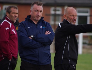 AFC Emley manager Darren Hepworth (centre) and his coaching staff watch on during the tense final minutes