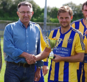 Peter Taylor presents Jamie Price with the 'Spud' Taylor Memorial Trophy after the Garforth Town Legend's Match