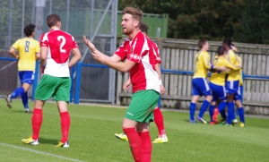 Harrogate defender Mike Morris waves his hand to indicate what he has seen