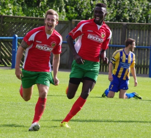 FA Cup hero: Harrogate Railway midfielder Adam Baker (left) with Lamin Colley (right) runs to celebrate his winning goal in the Preliminary Round victory at Garforth Town