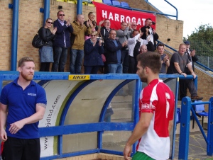 Harrogate Railway captain and man of the match Jason Mycoe walks off to applause from Railway's large travelling support