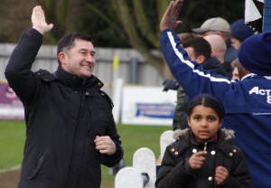 Tadcaster boss Paul Marshall 'high-fives' a supporter after Terry Taylor puts his side 5-0 up against Pickering