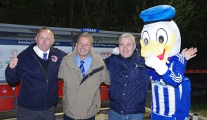 No players, but we got the Duck: Shaw Lane director of football Doug O'Connor, club secretary Dave Exley, matchday secretary Kev Wright and mascot Desmond the Duck celebrate promotion 